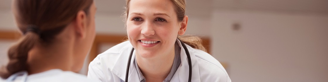 Female physician smiling at her patient