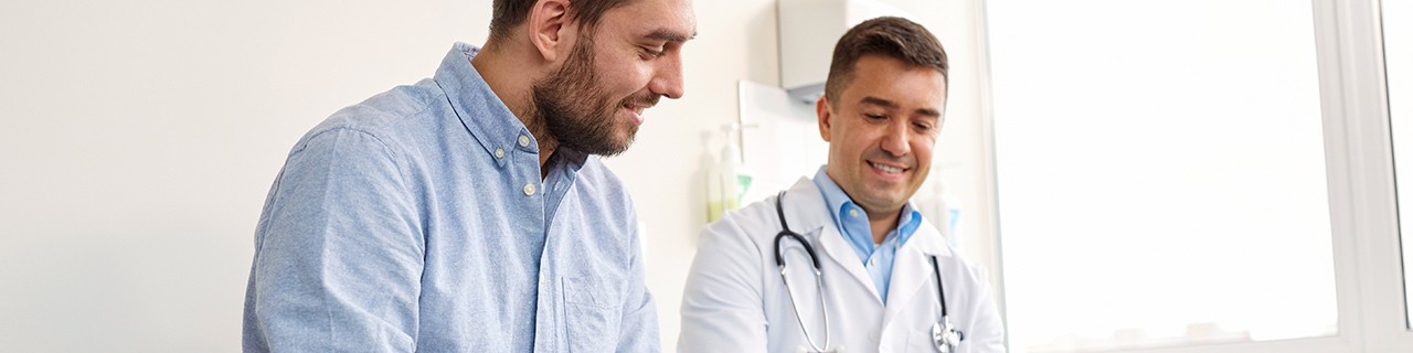 Male patient speaking with his male physician