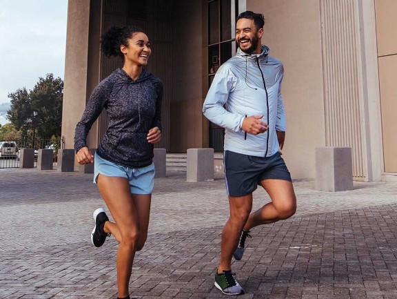 Couple running together in the city