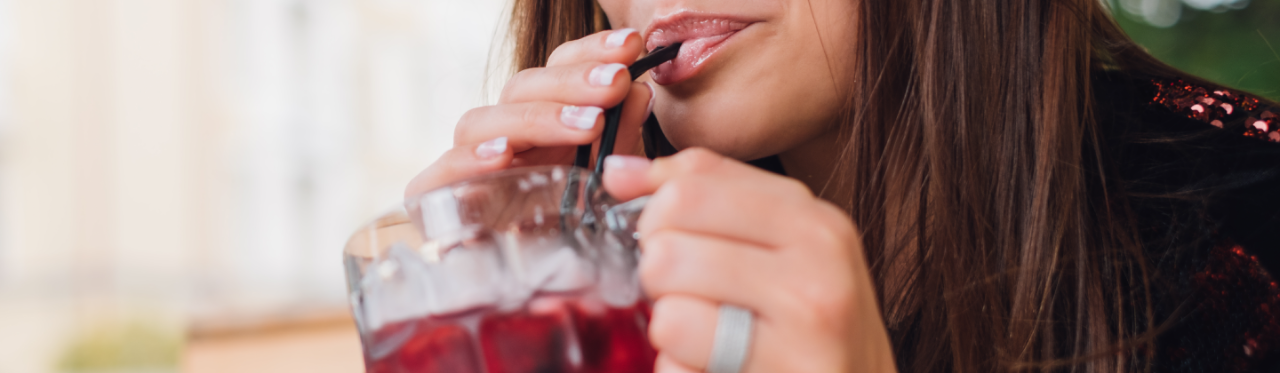 Woman drinks cranberry juice to prevent getting a urinary tract infection.