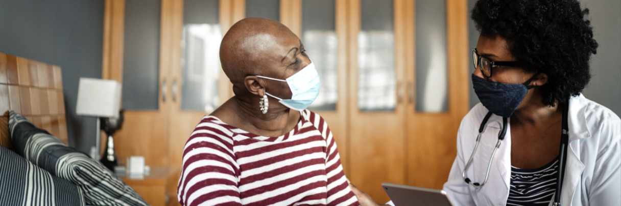 A cancer patient and her oncologist discuss the next steps in her treatment plan.