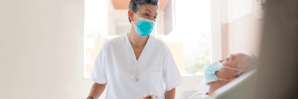 Woman nurse helping a patient